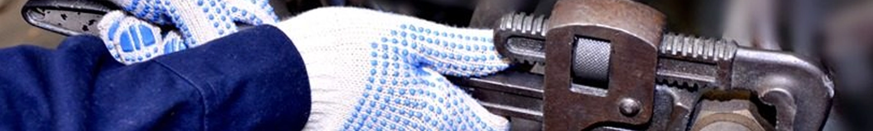 Person working with industrial machine while maintaining safety protocol